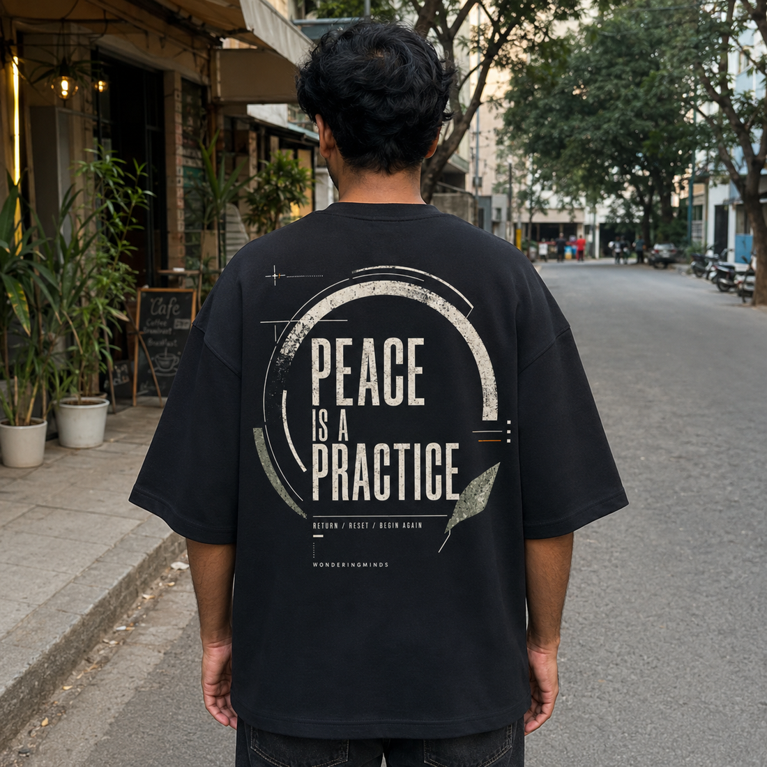Peace is a Practice Oversized Tee back artwork and print placement by Wondering Minds